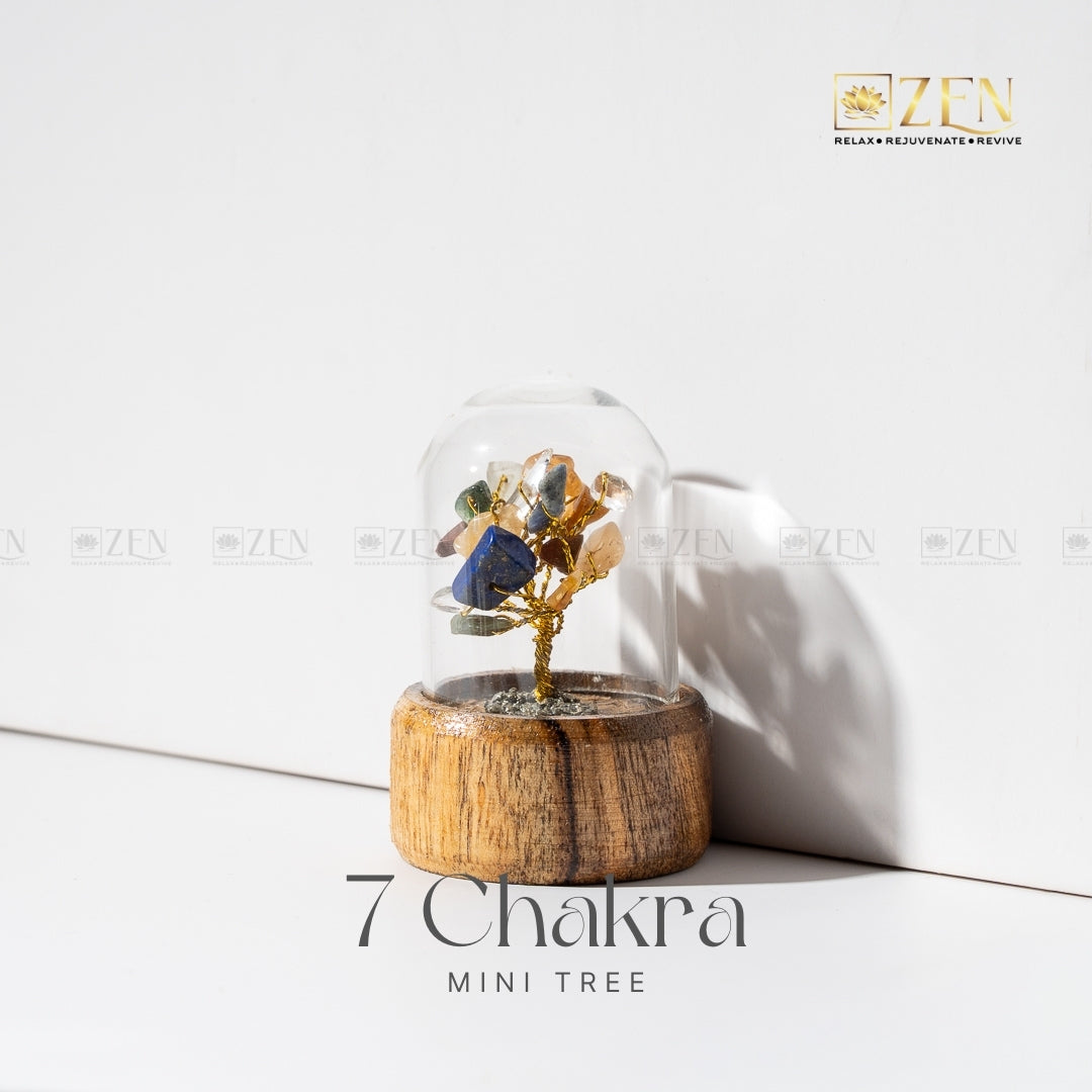 7 Chakra mini tree in a glass dome with wooden base on a white background.