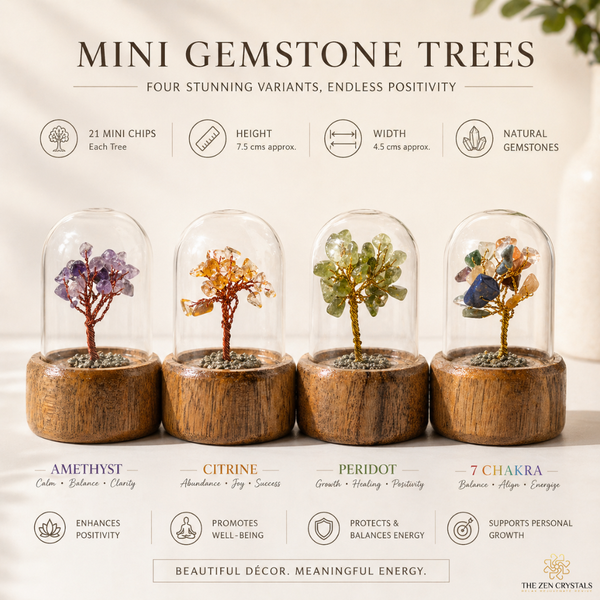 Mini gemstone trees in wooden bases with clear domes, each labeled with a gemstone color and its properties.
