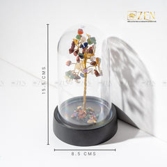 Decorative tree with multicolored stones under a glass dome on a white background, with 'Zen' branding.