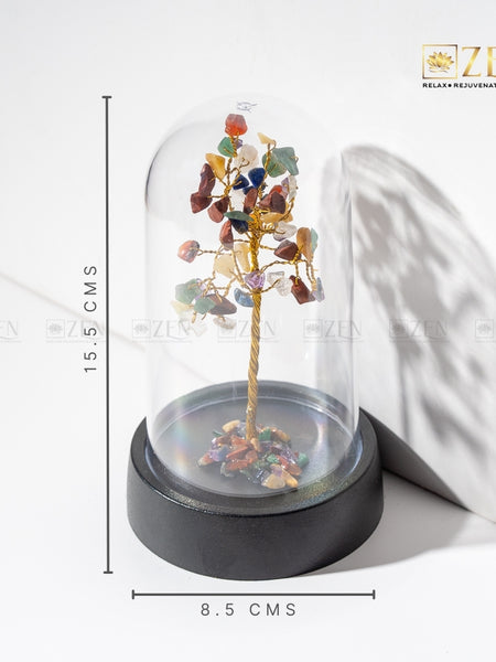 Decorative tree with multicolored stones under a glass dome on a white background, with 'Zen' branding.