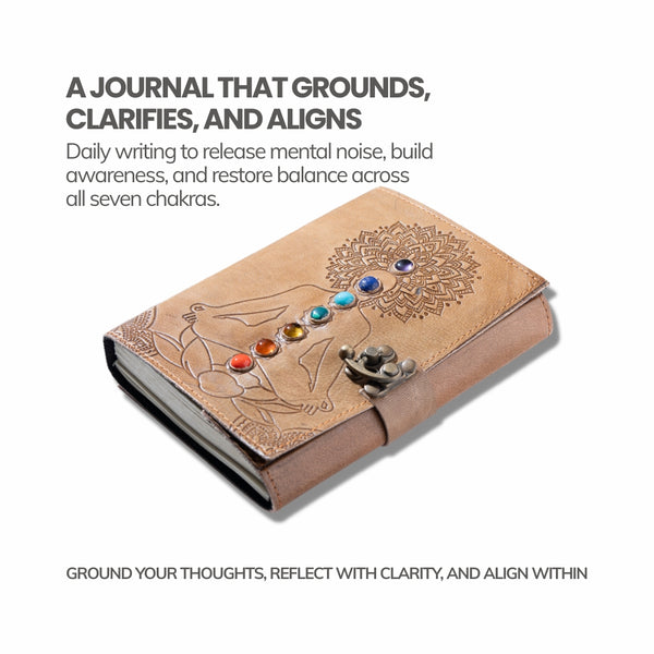Brown leather journal with chakra stones and mandala design on a white background