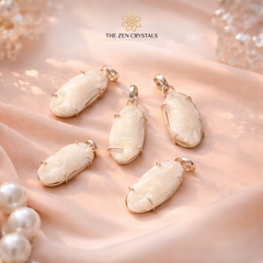 Shukra Mani pendants on a soft pink fabric with 'The Zen Crystals' logo.