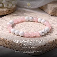 Love Energy Bracelet with pink and white beads on a stone surface, featuring 'The Zen Crystals' brand.