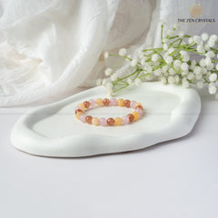 happiness and tranquility bracelet  on a white surface, featuring The Zen Crystals branding.