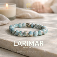 Larimar bracelet on a stone surface with a candle in the background, branded 'The Zen Crystals'.