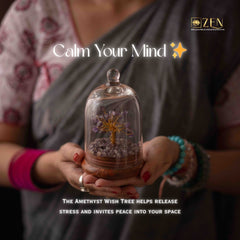Person holding a glass dome with an amethyst wish tree, promoting peace and stress release.