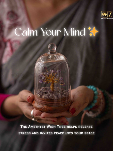 Person holding a glass dome with an amethyst wish tree, promoting peace and stress release.