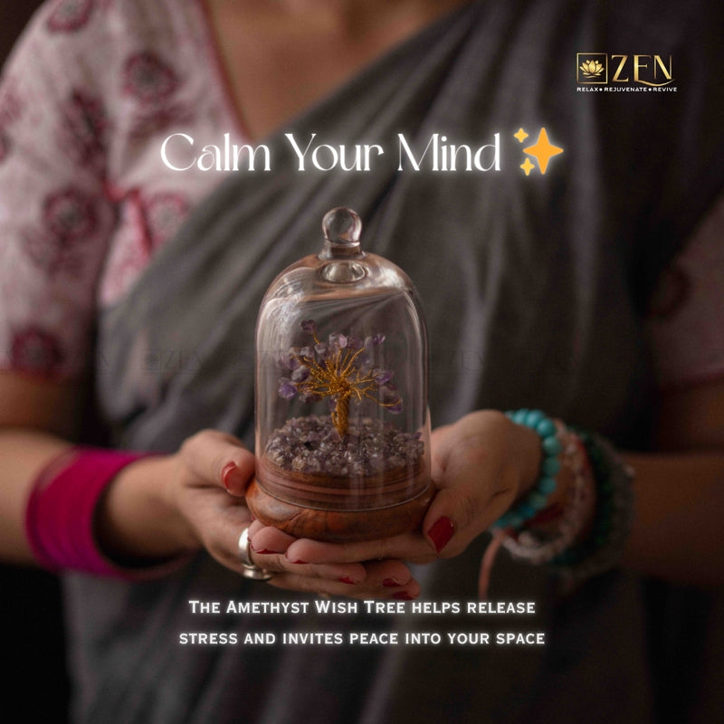 Person holding a glass dome with an amethyst wish tree, promoting peace and stress release.