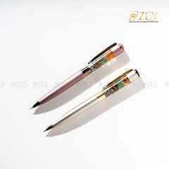 Money Magnet - Ballpoint Pen in Metallic Pink with Pyrite, Tiger Eye, Green Aventurine, and Citrine crystal chunks inside the barrel | the zen crystals