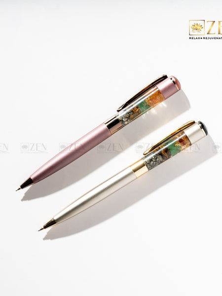 Money Magnet - Ballpoint Pen in Metallic Pink with Pyrite, Tiger Eye, Green Aventurine, and Citrine crystal chunks inside the barrel | the zen crystals