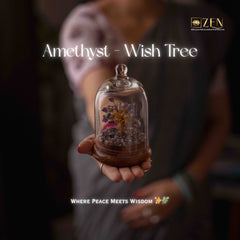 Person holding a glass dome with an amethyst wish tree and 'ZEN' branding.