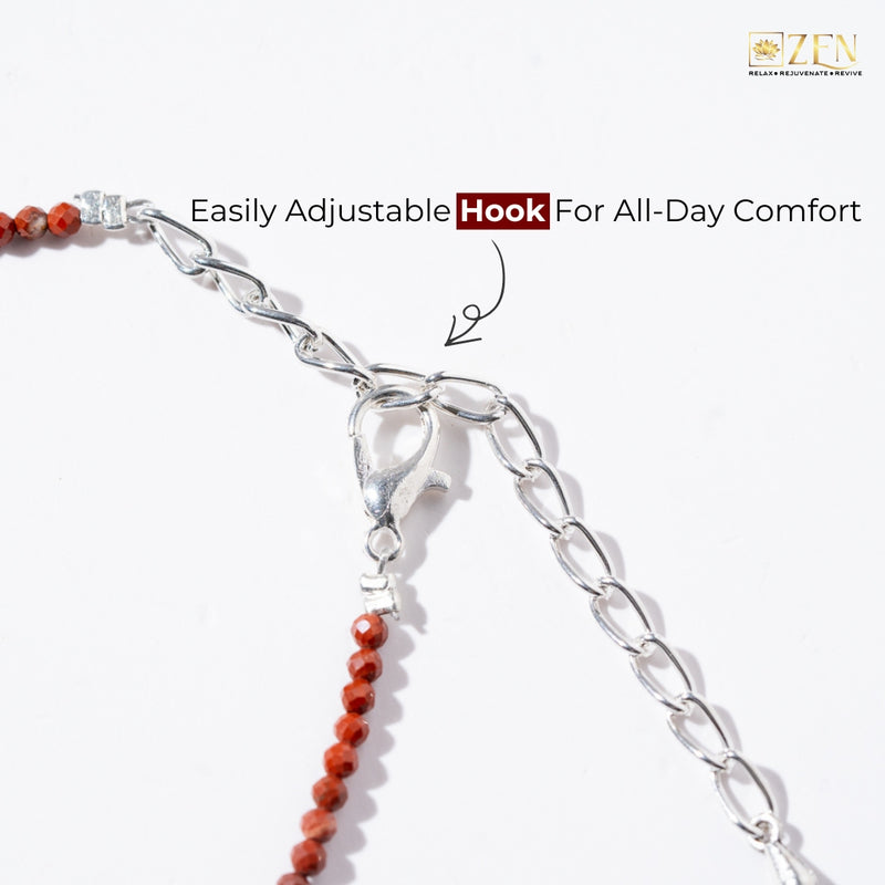 Close-up of a anklet with an easily adjustable hook on a white background, featuring the brand 'Zen'.