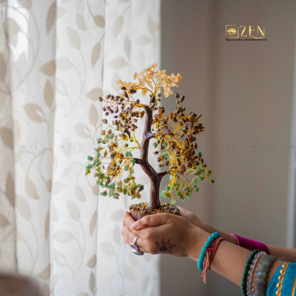 Person holding a decorative tree with a blurred background