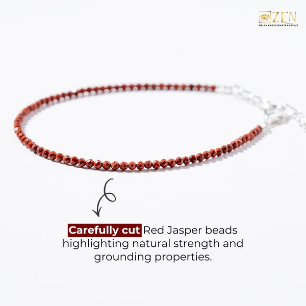 Red Jasper beaded necklace on a white background with text about natural strength and grounding properties.