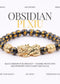 Black obsidian Pi Xiu bracelet with gold accents on a white background