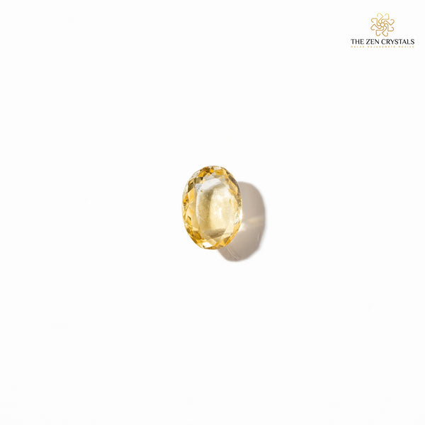 Yellow citrine crystal on a white background with 'The Zen Crystals' logo.