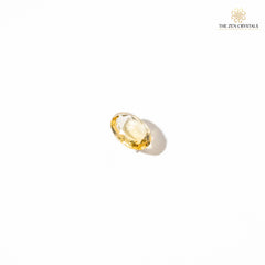citrine gemstone on a white background, branded 'The Zen Crystals'.