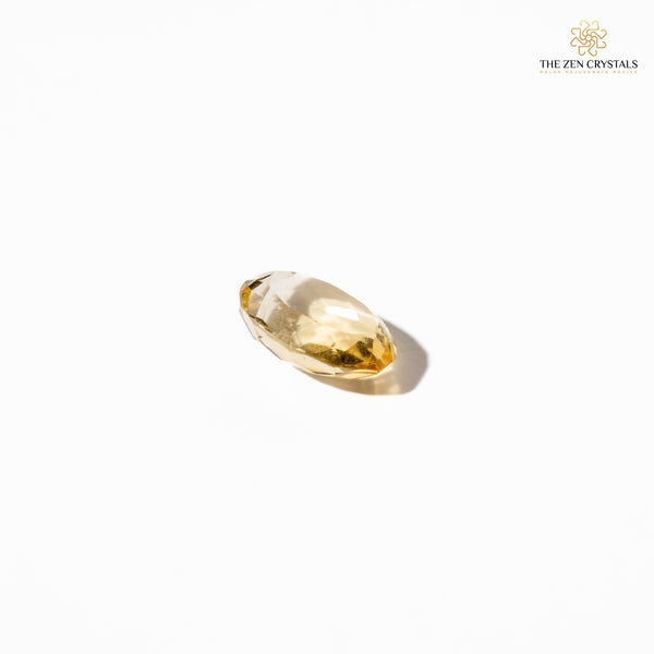 citrine gemstone on a white background with 'The Zen Crystals' branding.