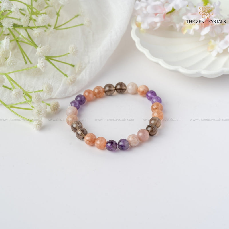 calm & peace energy bracelet on a white surface with flowers and 'The Zen Crystals' branding.