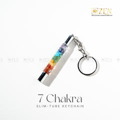 7 Chakra slim-tube keychain with colorful design on a white background