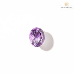 amethyst gemstone on a white background with 'The Zen Crystals' branding.