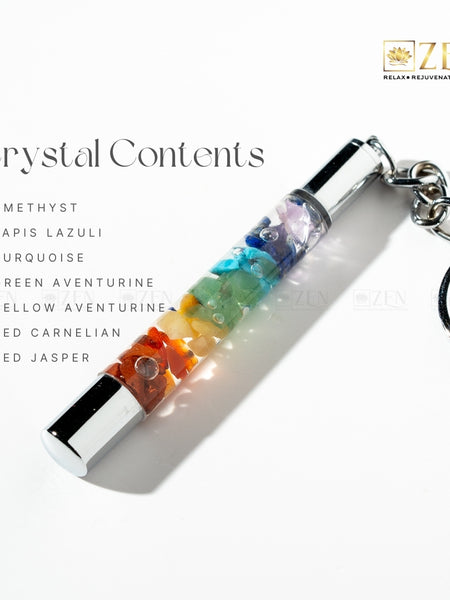 Crystal keychain with colored stones and 'Zen' brand logo on a white background