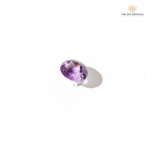 amethyst crystal on a white background with 'The Zen Crystals' logo.