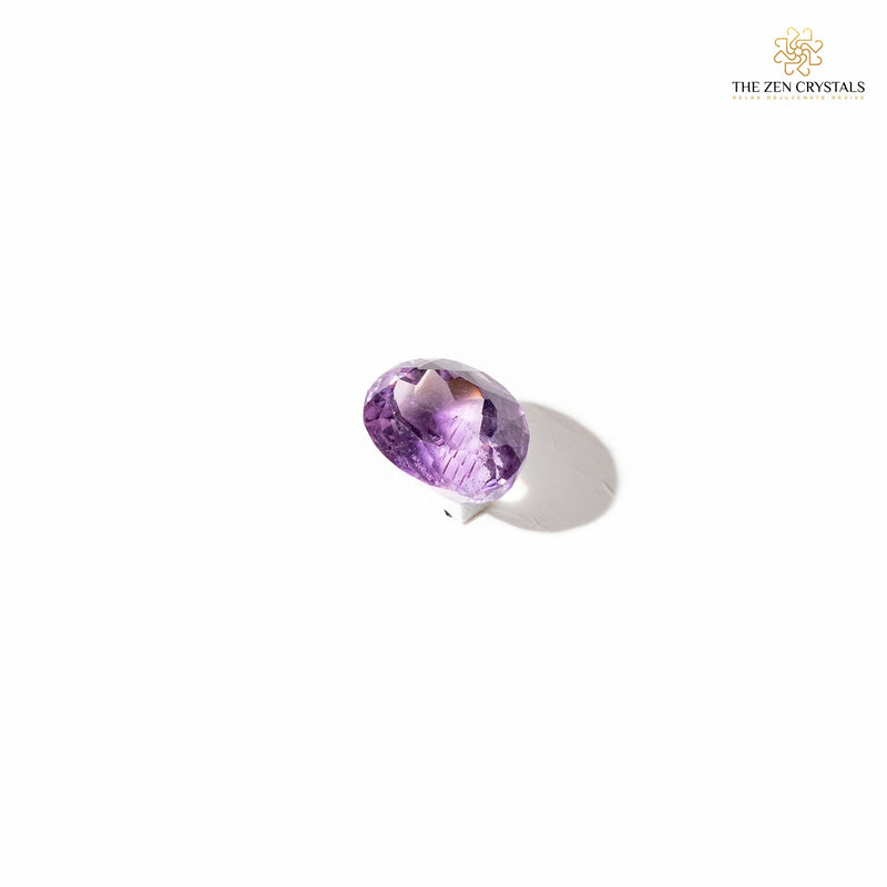 amethyst crystal on a white background with 'The Zen Crystals' logo.