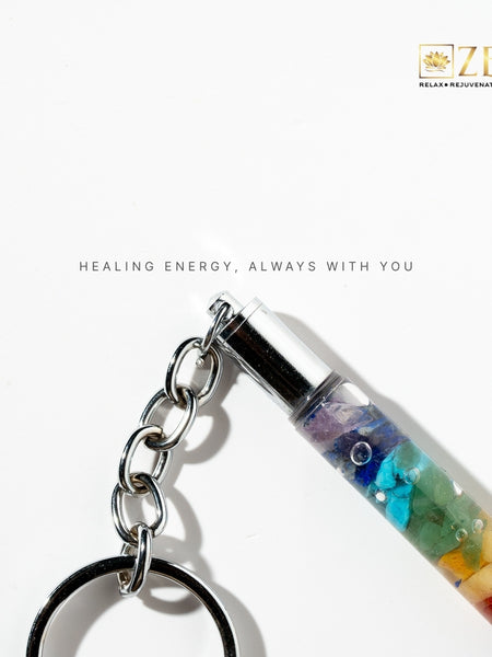 7 Chakra stone keychain with a white background and 'Zen' brand logo.