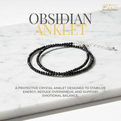 The Zen Crystals Obsidian anklet on a marble surface 