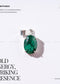 Malachite pendant with silver setting on a white background, featuring text about the crystal's properties and brand name.