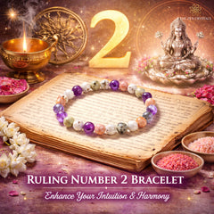 Ruling Number 2 bracelet on an open book with a statue and candles, featuring text about enhancing intuition and harmony.