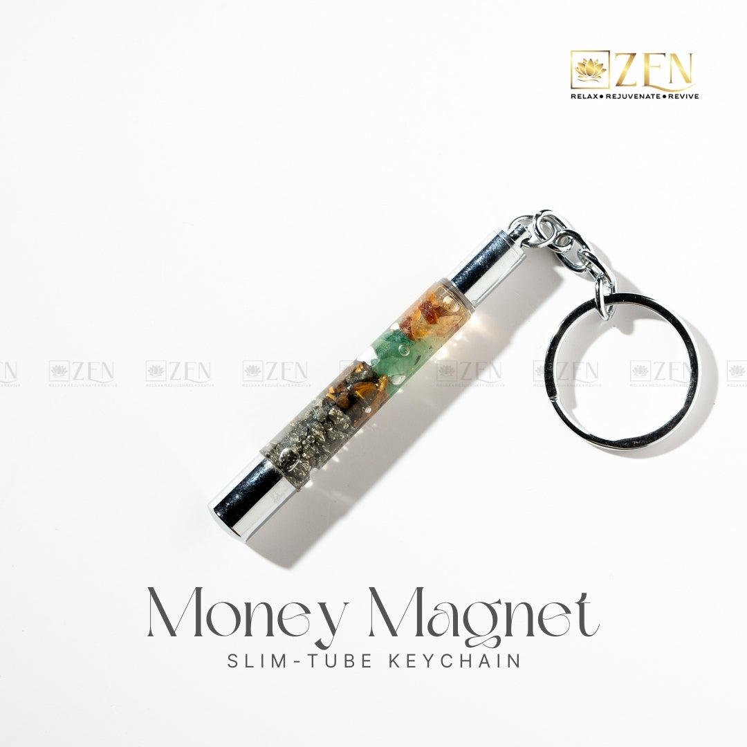 Money Magnet slim-tube keychain with crystals on a white background, featuring the ZEN brand.
