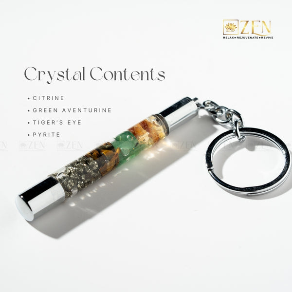Money Magnet Crystal keychain with visible stones on a white background, featuring the brand 'Zen'.