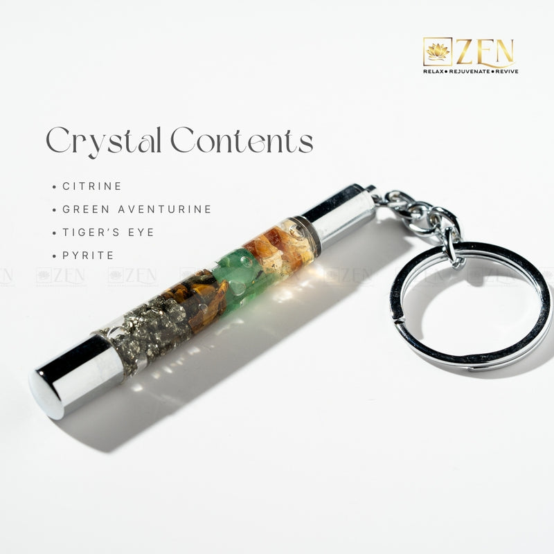 Money Magnet Crystal keychain with visible stones on a white background, featuring the brand 'Zen'.