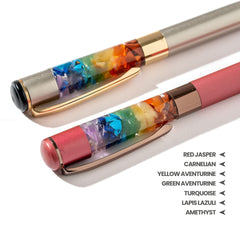Two pens with colorful gemstone inlays on a white background