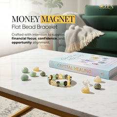 Money Magnet Flat bead bracelet on a table with crystals and a book titled 'Crystal Healing' in a home setting.
