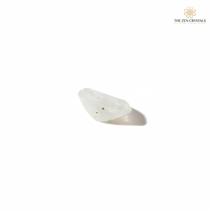 side view of moonstone crystal on a white background