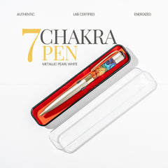 7 Chakra Pen with colorful gemstones in a white case on a light gray background