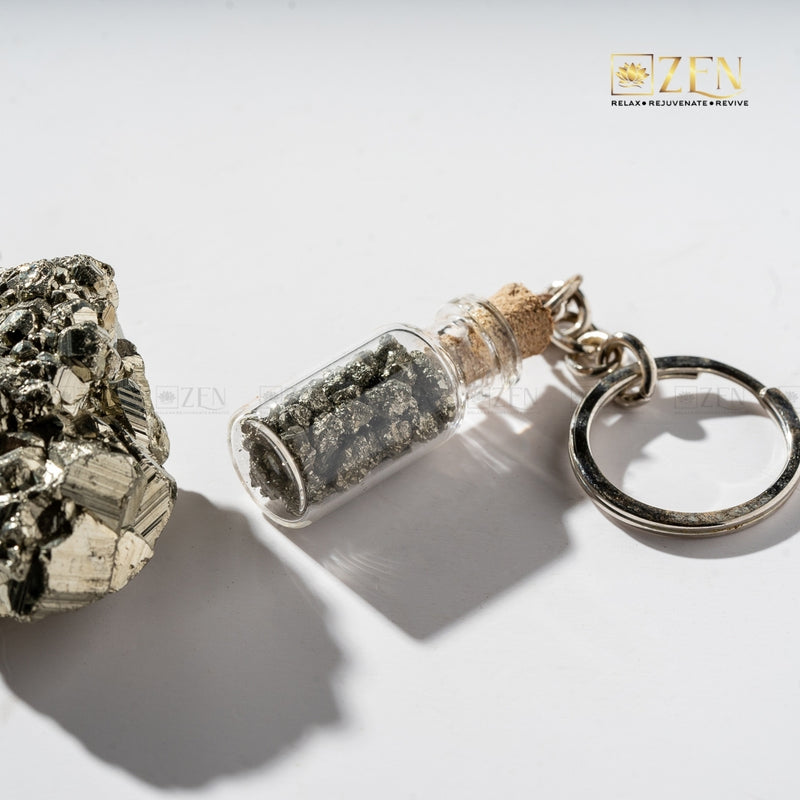 Rustic treasure bottle-shaped keychain filled with pyrite crystals, perfect for everyday carry