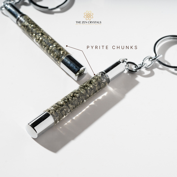 Keychain with pyrite chunks and silver accents on a white background, branded 'The Zen Crystals'.
