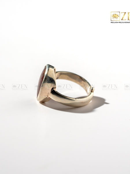silver ring with a red jasper gemstone on a white background, featuring the 'Zen' brand.