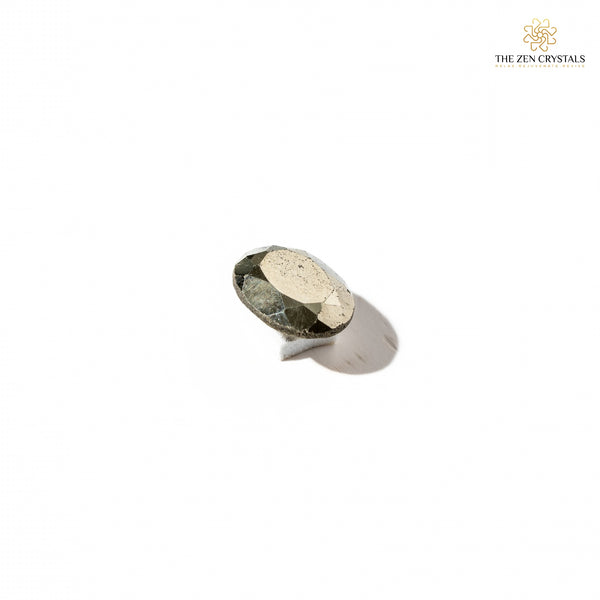 natural pyrite on a white background, branded 'The Zen Crystals'.