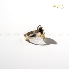 silver ring of red jasper side view on a white background with 'Zen' branding.