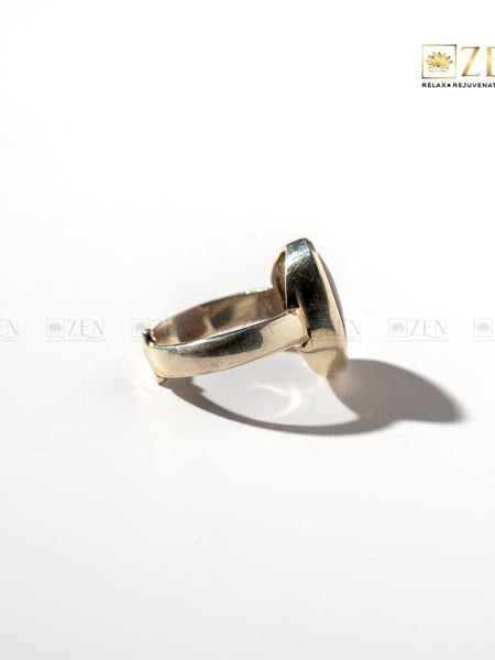 silver ring of red jasper side view on a white background with 'Zen' branding.
