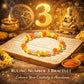 Ruling Number 3 Bracelet with Buddha statue, candle, and astrological symbols on a wooden surface.