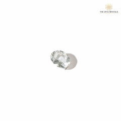 clear quartz crystal on a white background, branded 'The Zen Crystals'.