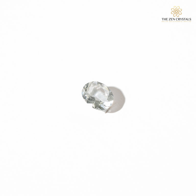 clear quartz crystal on a white background, branded 'The Zen Crystals'.