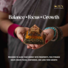 Person holding a money magnet pyramid stone with 'Balance, Focus, Growth' text and ZEN logo.