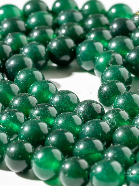 Close-up of green beads on a white background with 'ZEN' branding.